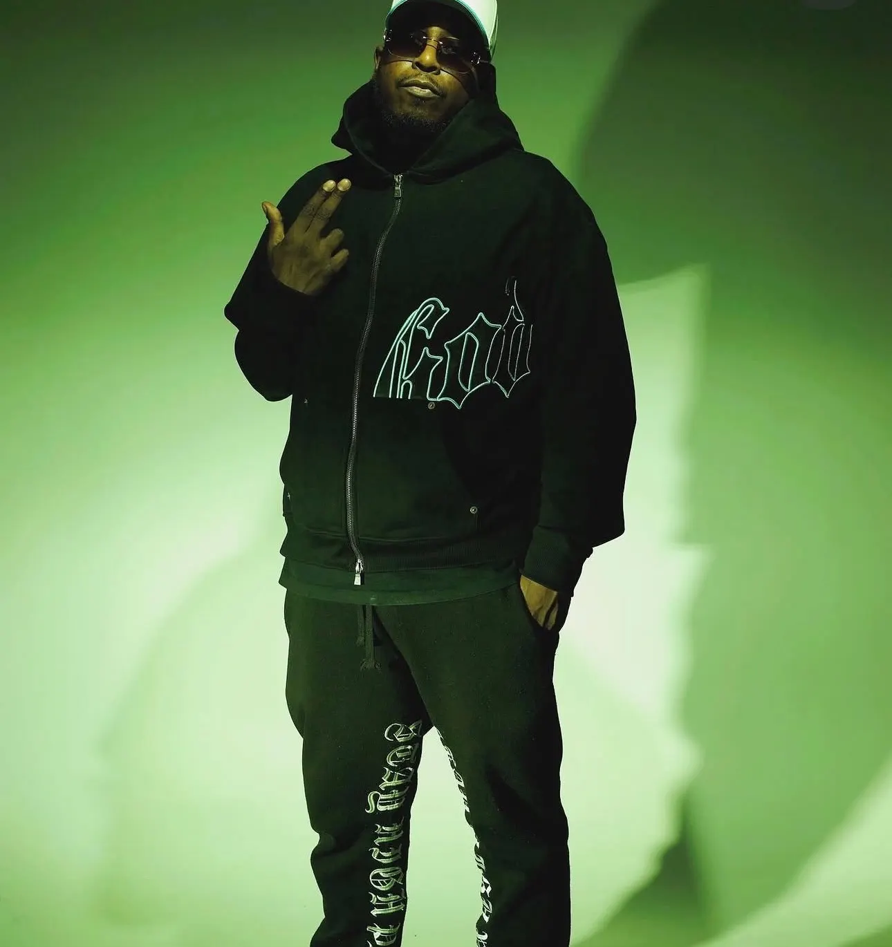 DJ Swiizzy in green light