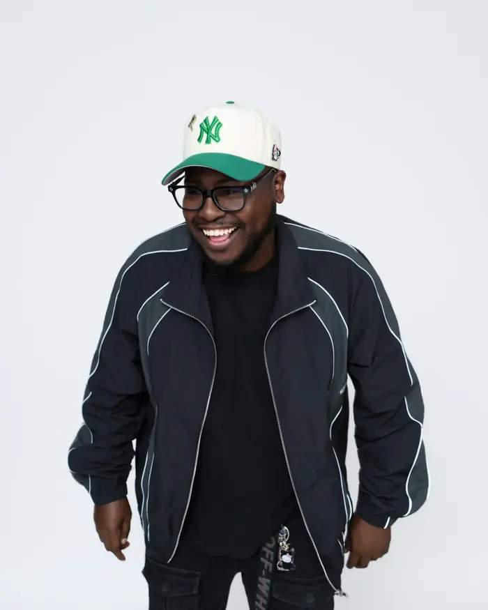 DJ Swiizzy laughing in the studio